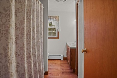 Nestled in the desirable Warwick Neck community, this inviting