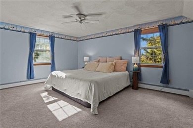 Nestled in the desirable Warwick Neck community, this inviting