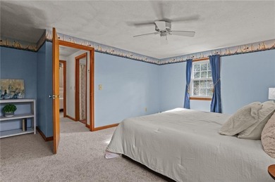 Nestled in the desirable Warwick Neck community, this inviting