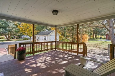Nestled in the desirable Warwick Neck community, this inviting