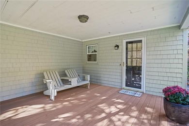 Nestled in the desirable Warwick Neck community, this inviting