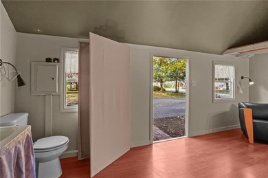 Nestled in the desirable Warwick Neck community, this inviting