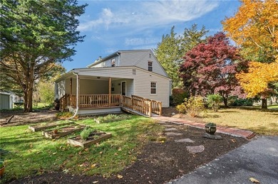 Nestled in the desirable Warwick Neck community, this inviting