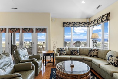 This spectacular 5 bedroom, 4 full bath, 2nd floor beachfront