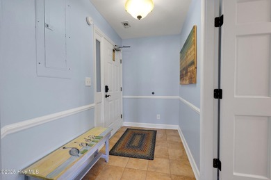 Discover the ultimate coastal living experience at Unit 113A