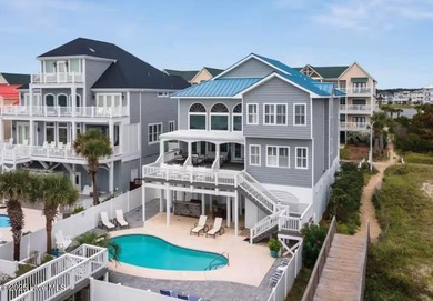 Oceanfront paradise awaits! This stunning 8-bedroom, 6
