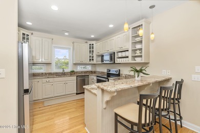 This stunning home is located in the highly desirable gated