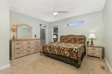 This stunning home is located in the highly desirable gated