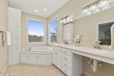 This stunning home is located in the highly desirable gated