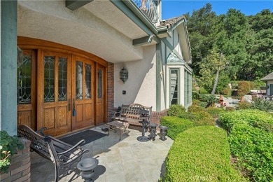 Perched above the Glendora foothills on nearly 4 secluded acres