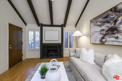 Come to see this recently refreshed townhome with the rare lake