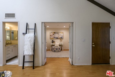 Come to see this recently refreshed townhome with the rare lake