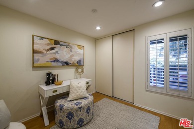 Come to see this recently refreshed townhome with the rare lake