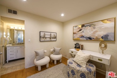 Come to see this recently refreshed townhome with the rare lake