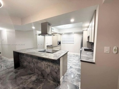 STUNNING HOME IN THE HEART OF TAMARAC. NEW ROOF NEW ELEVATOR ALL