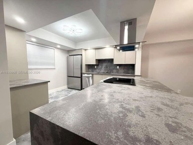 STUNNING HOME IN THE HEART OF TAMARAC. NEW ROOF NEW ELEVATOR ALL