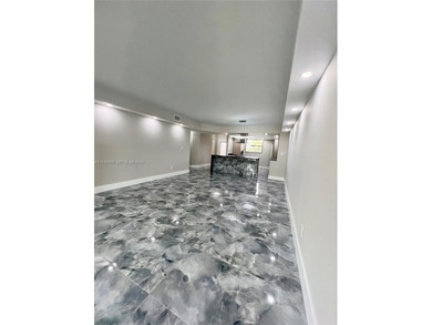 STUNNING HOME IN THE HEART OF TAMARAC. NEW ROOF NEW ELEVATOR ALL