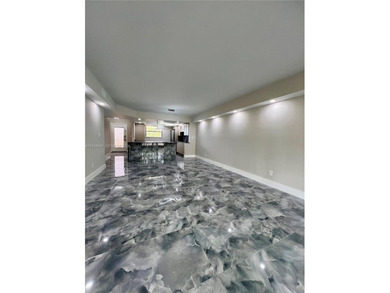 STUNNING HOME IN THE HEART OF TAMARAC. NEW ROOF NEW ELEVATOR ALL