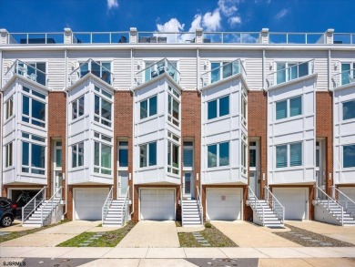 Welcome to The Waves -- a stunning townhome offering 5 spacious