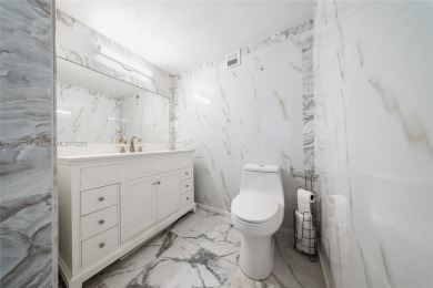 Step into luxury in this fully renovated 1 bed + den, 1.5 bath