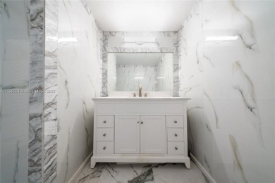 Step into luxury in this fully renovated 1 bed + den, 1.5 bath