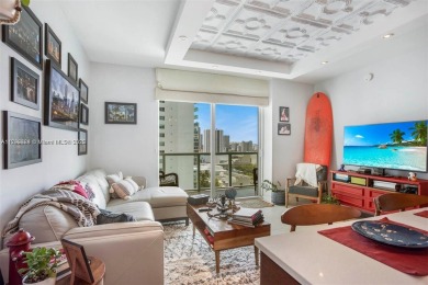 Live the vibrant Edgewater lifestyle in this impeccably