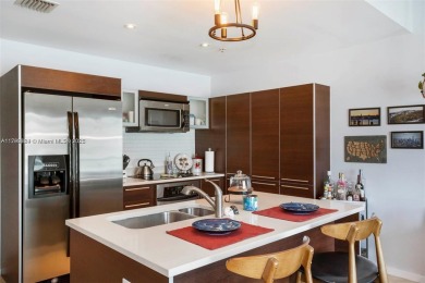 Live the vibrant Edgewater lifestyle in this impeccably