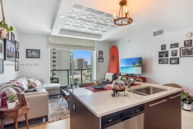 Live the vibrant Edgewater lifestyle in this impeccably
