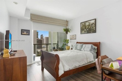 Live the vibrant Edgewater lifestyle in this impeccably