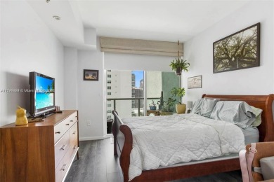 Live the vibrant Edgewater lifestyle in this impeccably