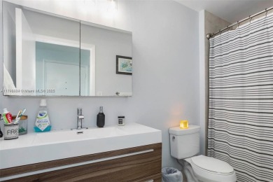 Live the vibrant Edgewater lifestyle in this impeccably