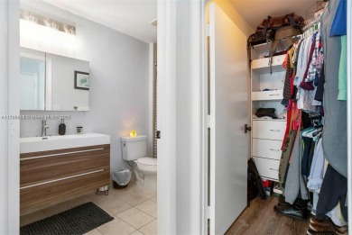 Live the vibrant Edgewater lifestyle in this impeccably