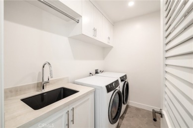 This stunning new construction home in Manhattan Beach offers 6