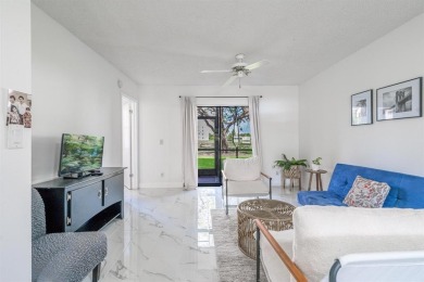 This 2 Bed, 2 Bath 1st Floor corner unit residence with screen