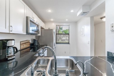 This 2 Bed, 2 Bath 1st Floor corner unit residence with screen