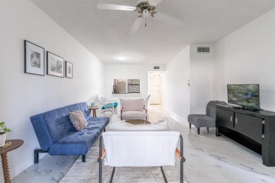 This 2 Bed, 2 Bath 1st Floor corner unit residence with screen