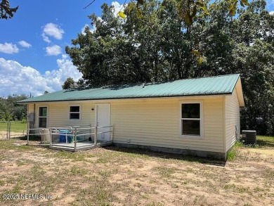 PRICE IMPROVEMENT! Charming 3-Bedroom Country Home on nearly an