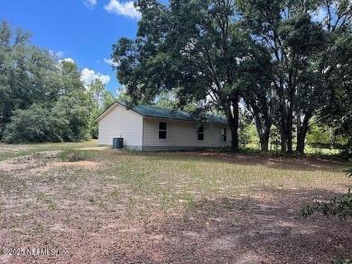 PRICE IMPROVEMENT! Charming 3-Bedroom Country Home on nearly an