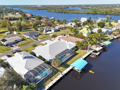 This BOATER'S DREAM offers coveted deep-water access five houses