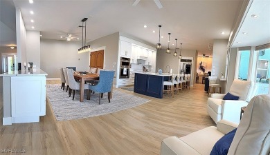 This BOATER'S DREAM offers coveted deep-water access five houses