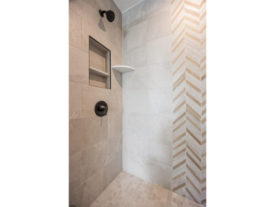 Incredible NEW CONSTRUCTION condo located just a short walk from