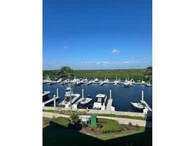 Middle floor Harbour House unit with Marina, bay and Ocean views