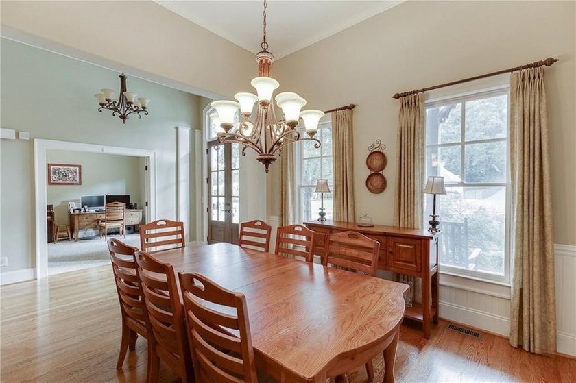 Nestled on a private one-acre homesite within the sought-after - photo 3