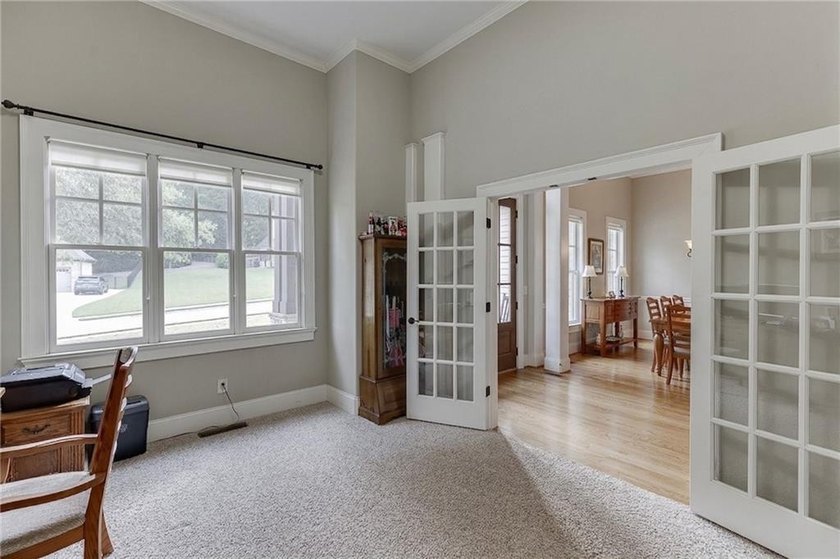 Nestled on a private one-acre homesite within the sought-after - photo 7