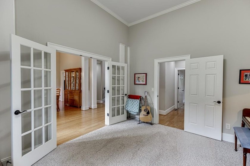 Nestled on a private one-acre homesite within the sought-after - photo 8