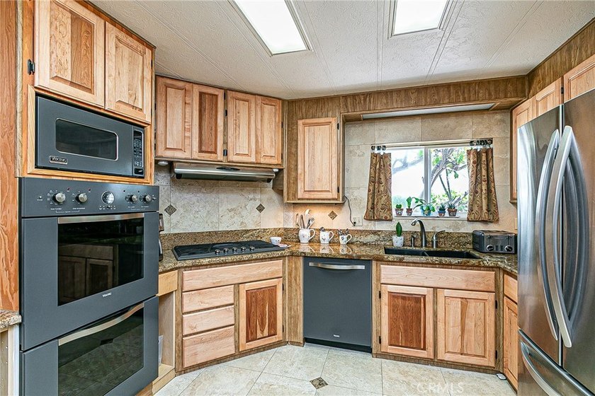 Updated &amp; Move-In Ready! This beautifully maintained 2-bedroom - photo 13