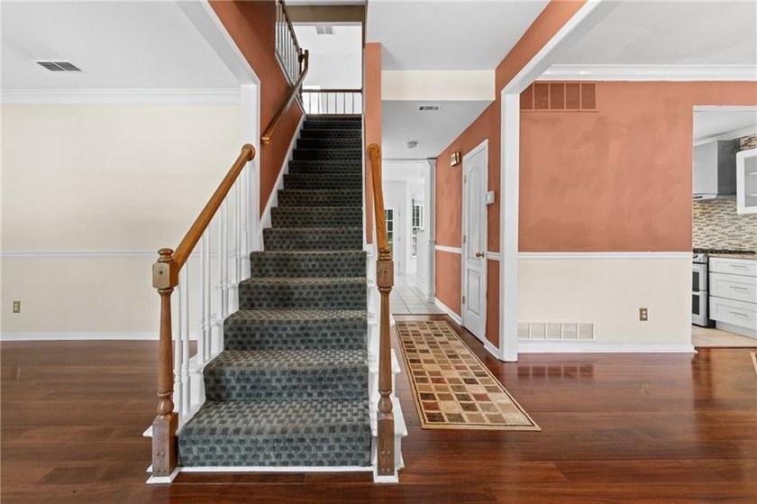 Welcome home to this beautifully maintained brick-front - photo 4