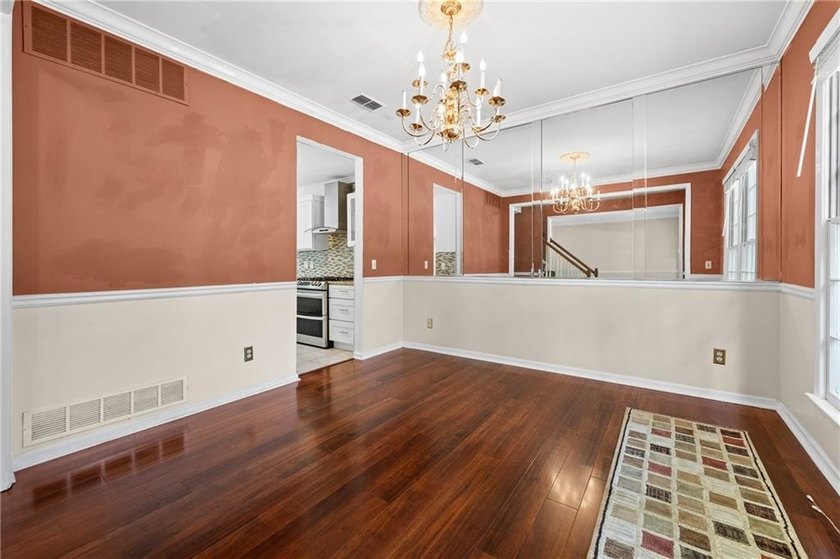 Welcome home to this beautifully maintained brick-front - photo 5