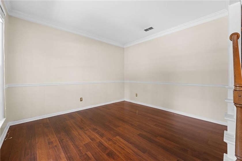 Welcome home to this beautifully maintained brick-front - photo 7