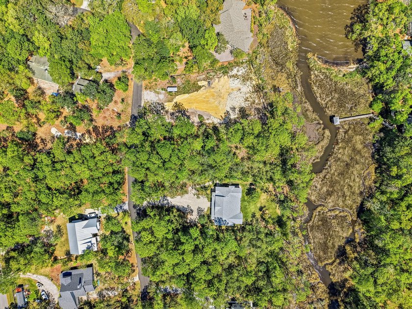 This beautiful waterfront homesite is tucked away in the - photo 3